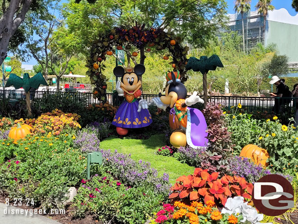 Mickey and Minnie Halloween decorations near the fountain.