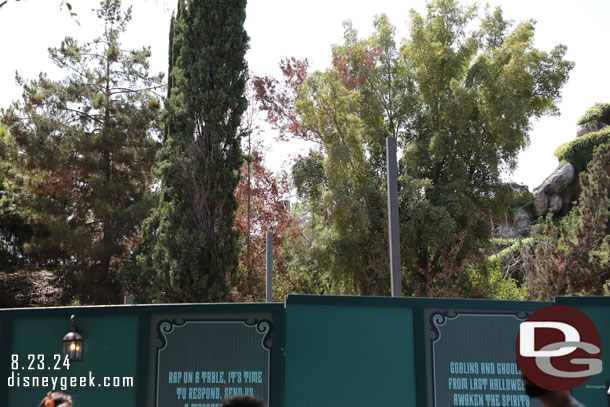 A couple of poles sticking up. Not sure if these are part of the new gift shop building or for something else.