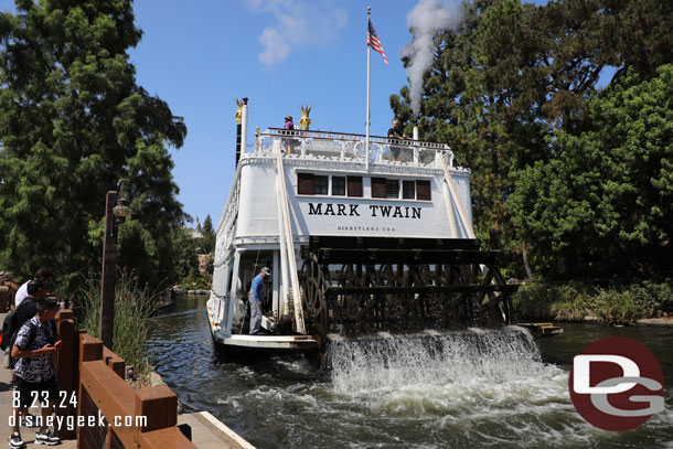 The Mark Twain Riverboat passing by.  A cast member checking the oil.