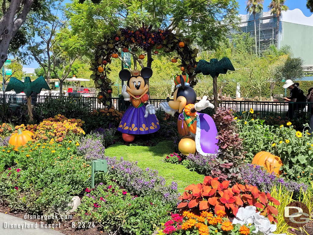 Mickey and Minnie Halloween decorations near the fountain.