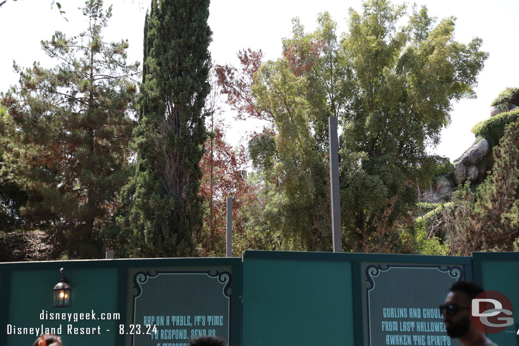 A couple of poles sticking up. Not sure if these are part of the new gift shop building or for something else.