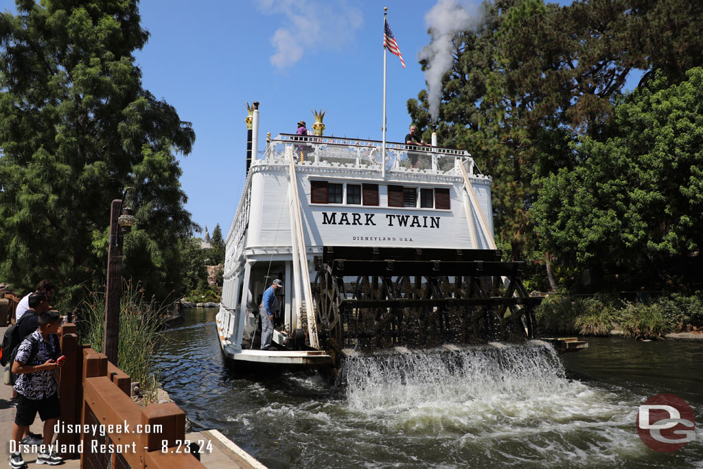 The Mark Twain Riverboat passing by.  A cast member checking the oil.