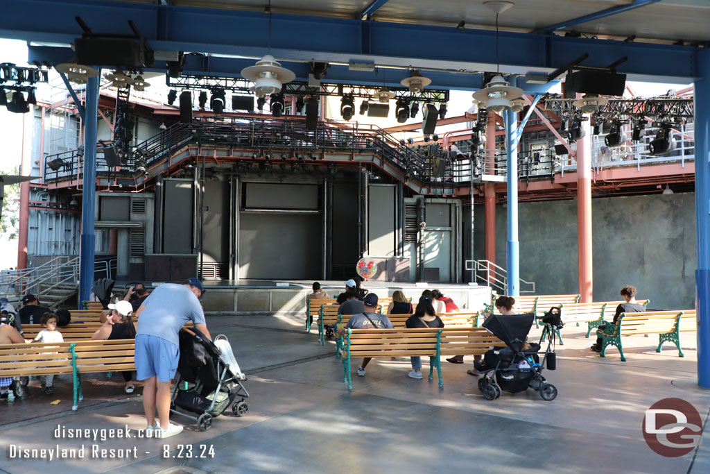 The backlot stage has nothing scheduled. Guests are just enjoying a seat in the shade.