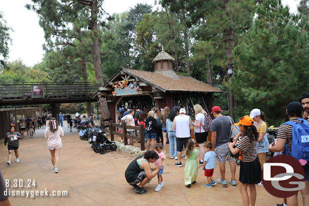 They have re-graded the walkway a bit.  So there is now an elevation change near the Winnie the Pooh entrance. This steers the queue along the fence and gives some stroller parking in front.