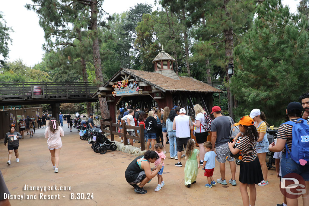 They have re-graded the walkway a bit.  So there is now an elevation change near the Winnie the Pooh entrance. This steers the queue along the fence and gives some stroller parking in front.