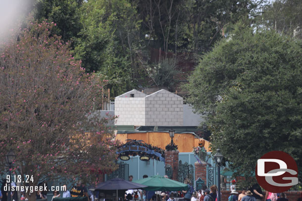 The new elevator structure rises above the walls now near the Haunted Mansion