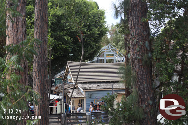 The Haunted Mansion gift shop is visible behind the Harbour Galley