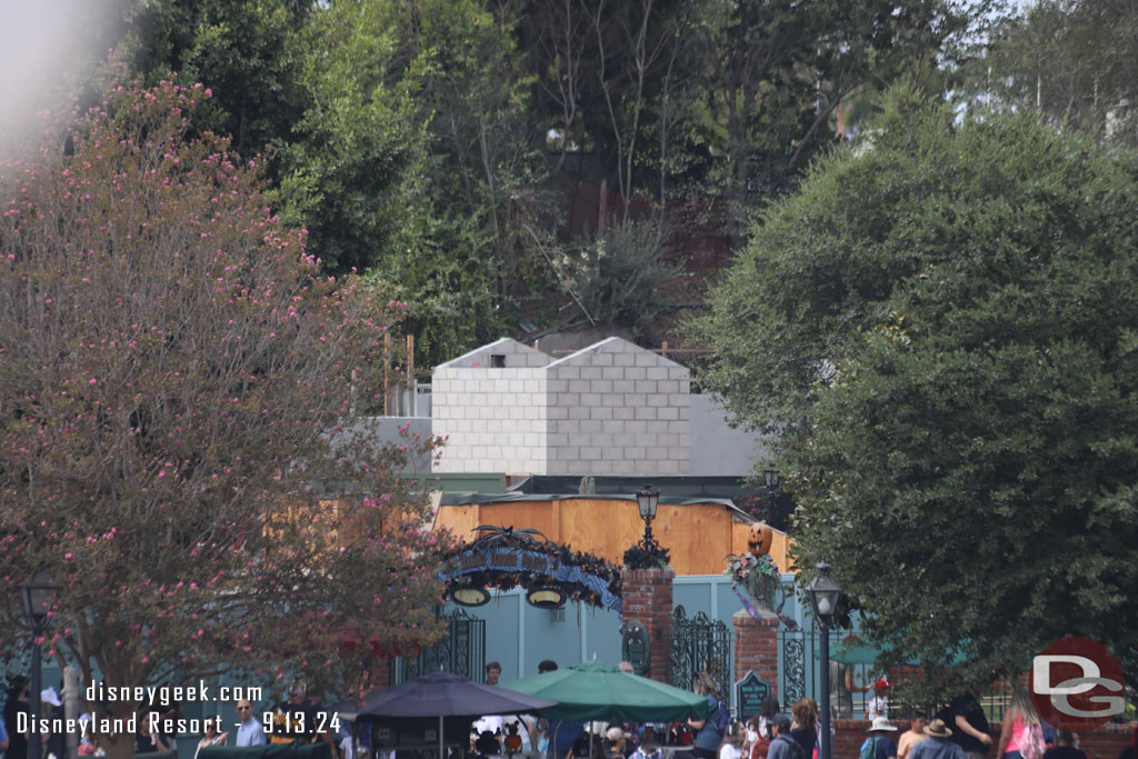 The new elevator structure rises above the walls now near the Haunted Mansion