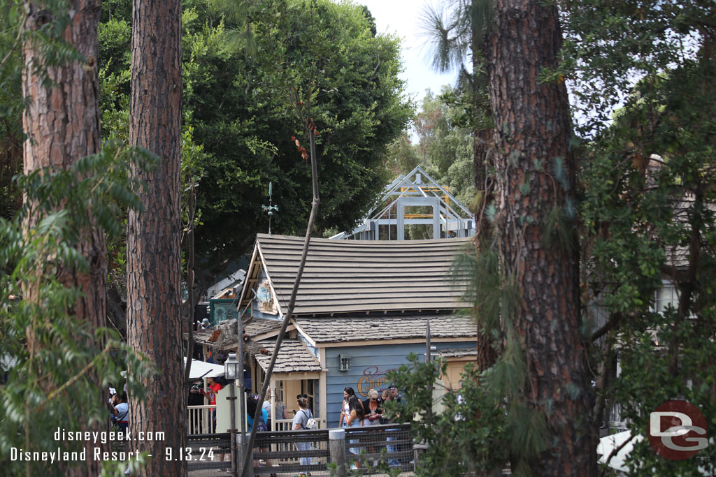 The Haunted Mansion gift shop is visible behind the Harbour Galley