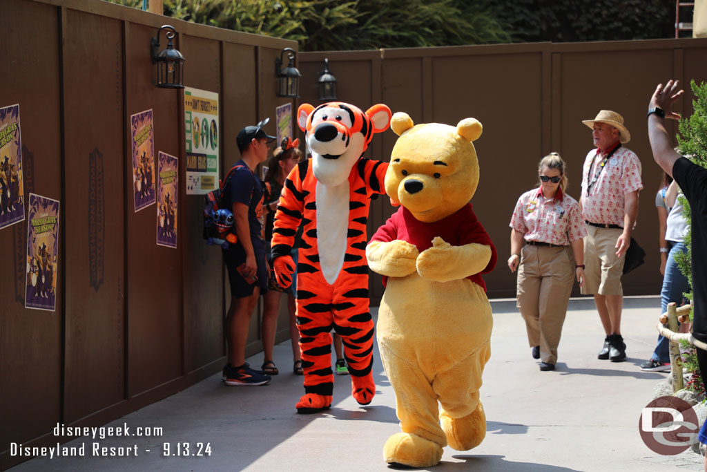 Winnie the Pooh and Tigger out for a stroll on their way to meet guests