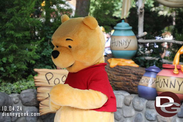 Winnie the Pooh out greeting guests