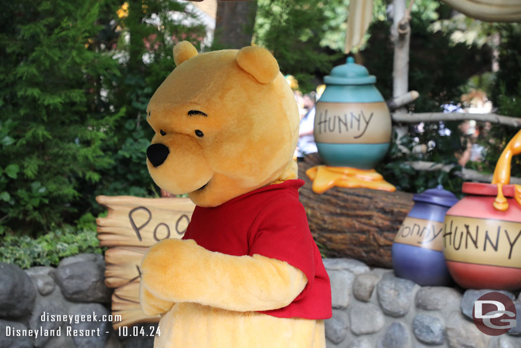 Winnie the Pooh out greeting guests