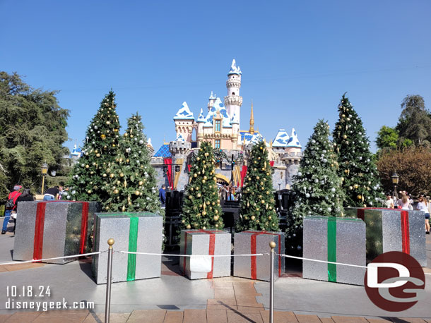 A stage with trees and presents is set up for taping the holiday special.