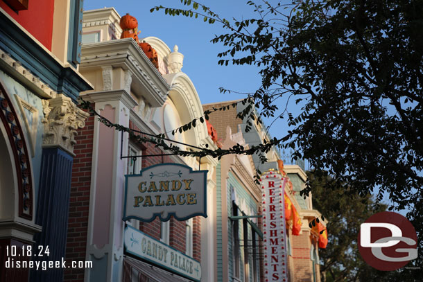 The Christmas lights have been installed in the trees.  You can see the power cords/vines stretching over the walkway.