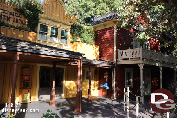 A wider view of the recently added Winnie the Pooh drinking fountain that seems out of place there.