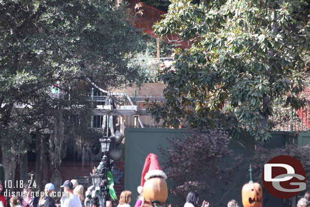 A shade structure is taking shape in the queue.