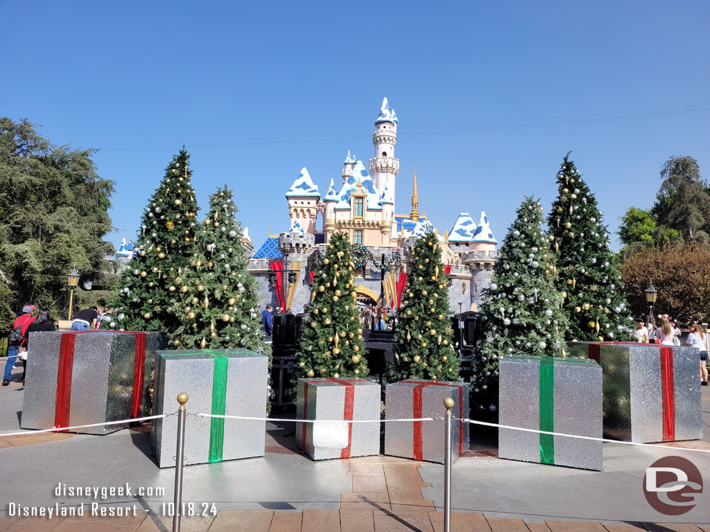 A stage with trees and presents is set up for taping the holiday special.