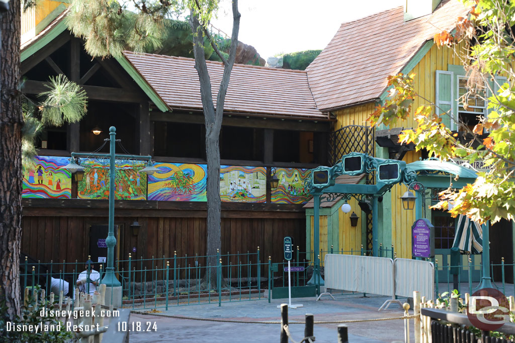 To the left of the entrance is a mural