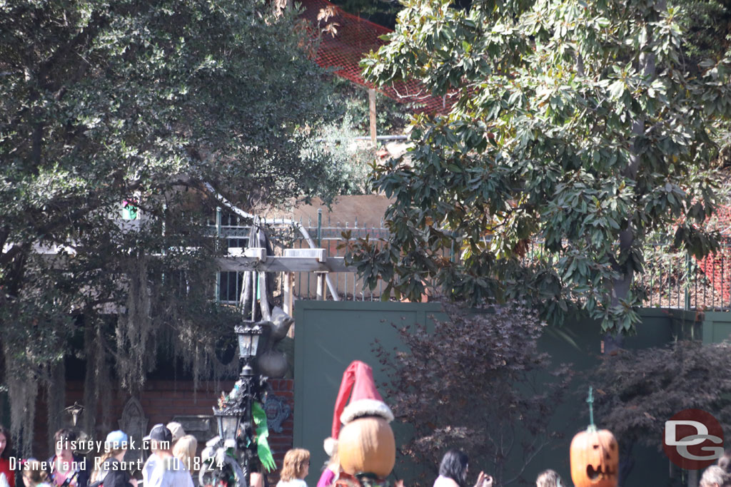 A shade structure is taking shape in the queue.