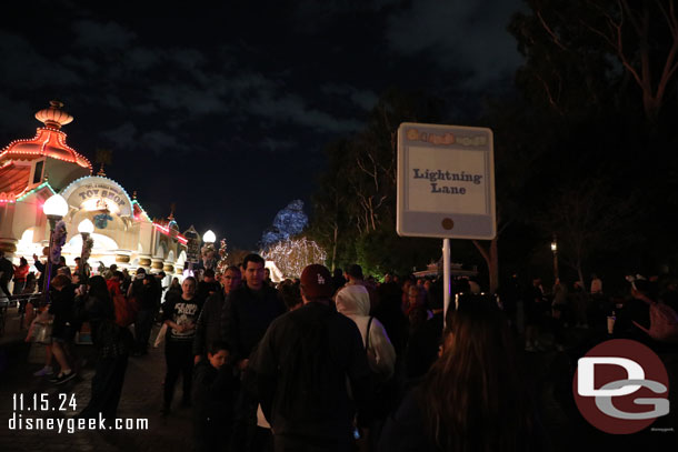 The Lightning Lane Return for it's a small world holiday stretched down the slope to Toontown.