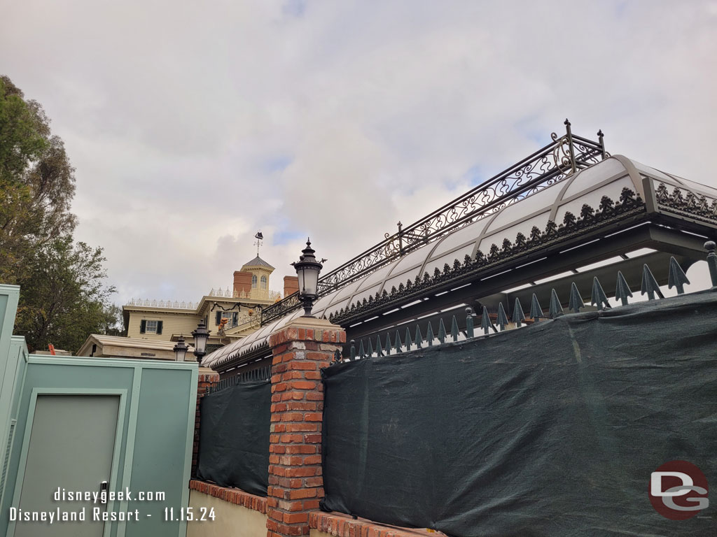 The Haunted Mansion queue is now partially covered