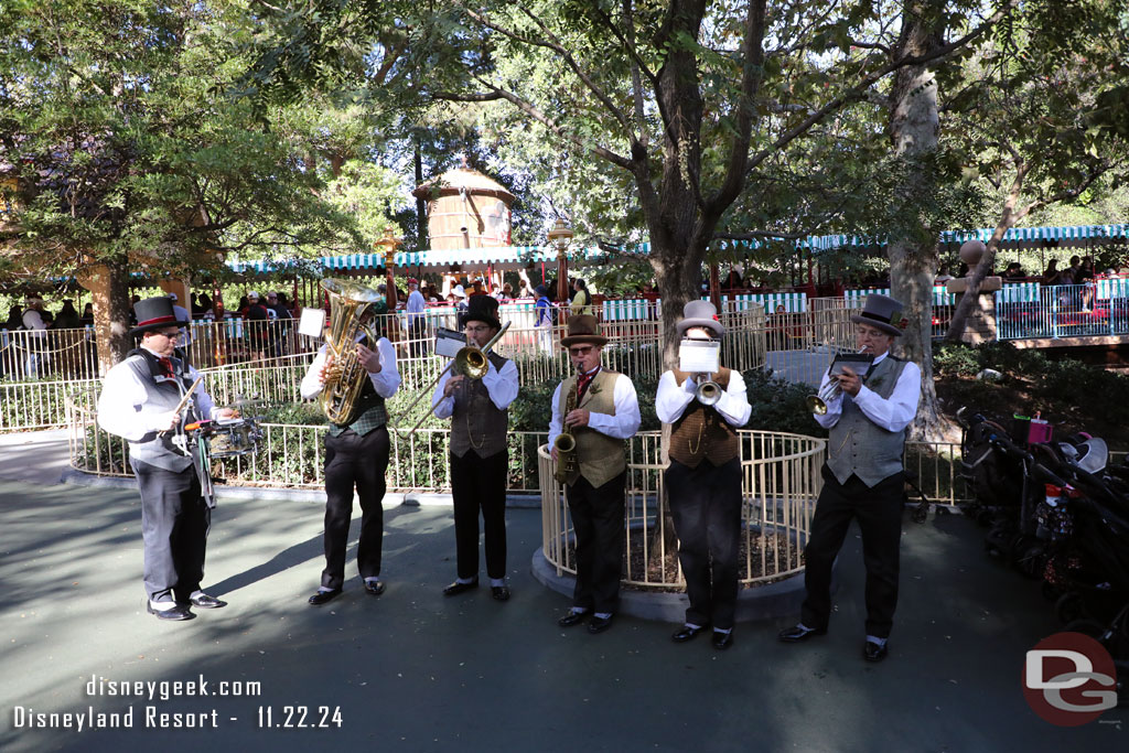 The Dickens Yuletide Band performs several sets outside the theatre. Here they are near the Toontown Train Station.  