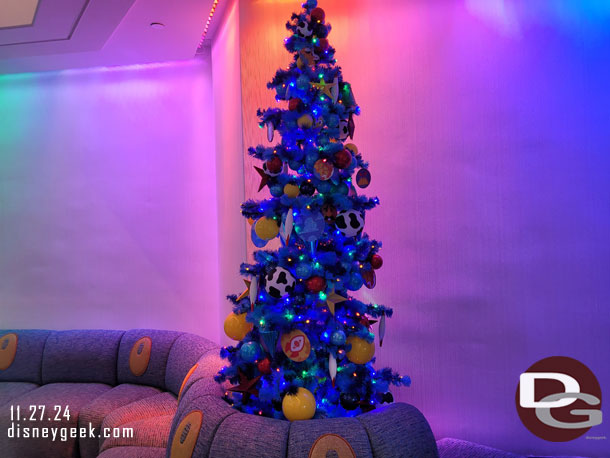 There area a number of Christmas trees decorated for different Pixar films throughout the lobby area.  No large tree. This is a Toy Story tree
