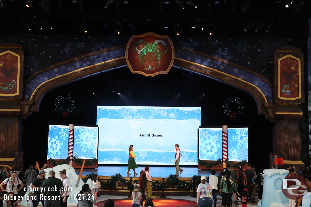 A couple of performers leading a sing along on the stage