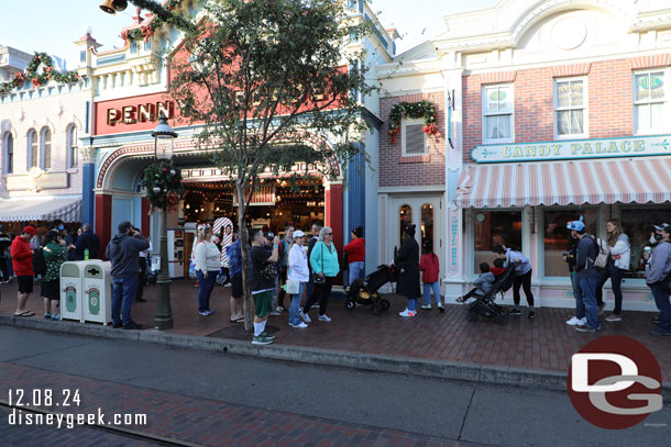 A line of guests waiting to purchase Candy Canes, there were also some photo props on hand.