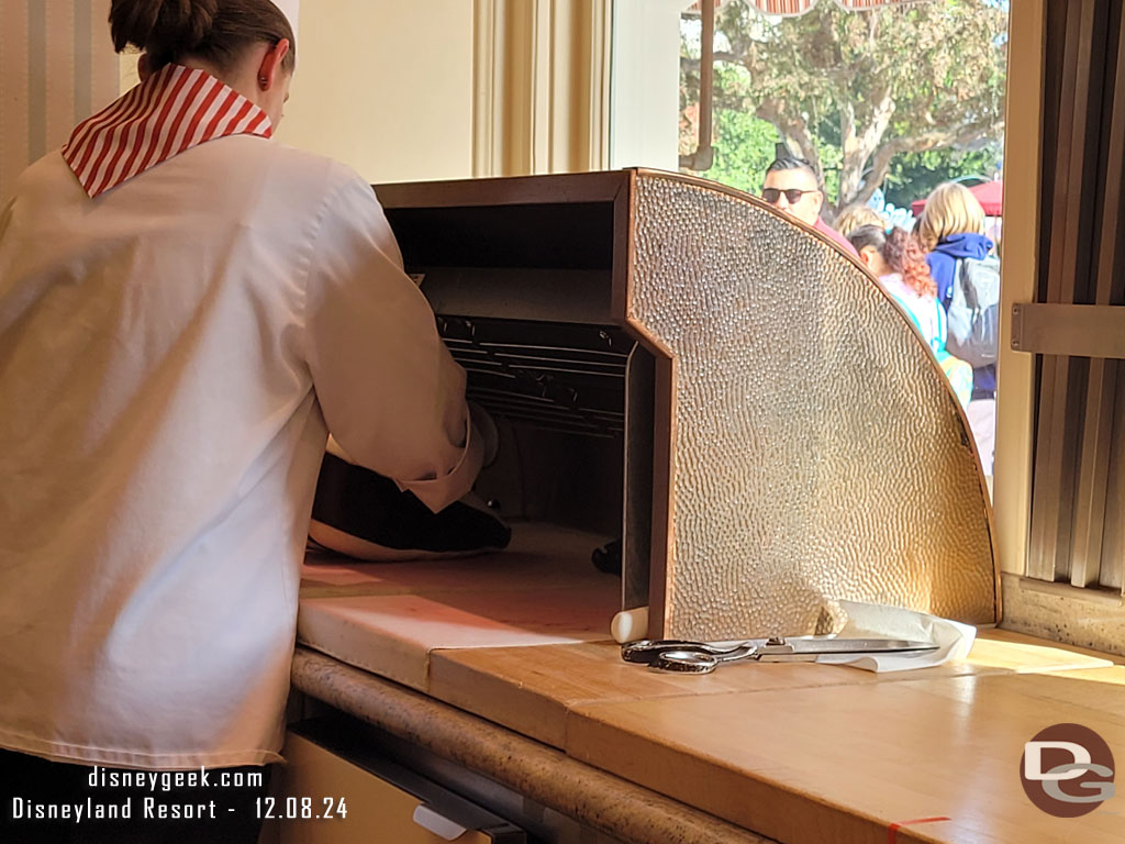 Cast members making candy canes.