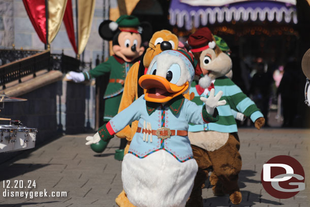 Donald Duck leads the characters out.