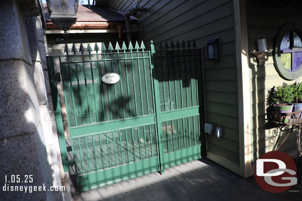 The backstage gate obstructing the back of the new gift shop as you exit the mansion.