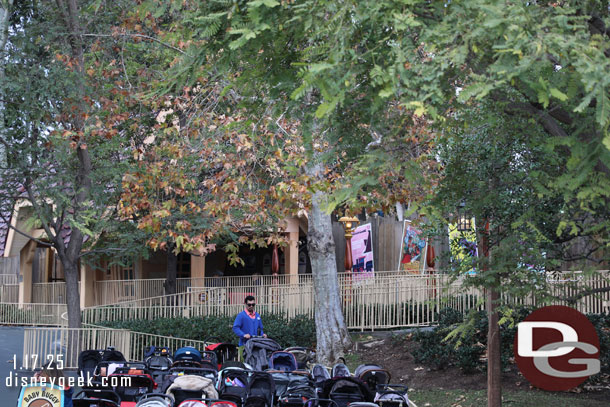 Cast members and posters at the train station.