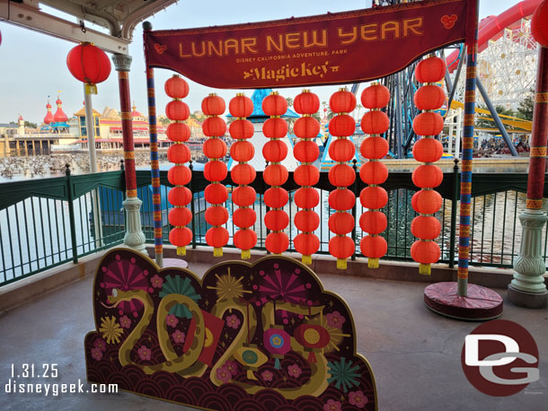 The Magic Key photo op is still available under the Silly Symphony Swings (the buttons were only available the first week though)