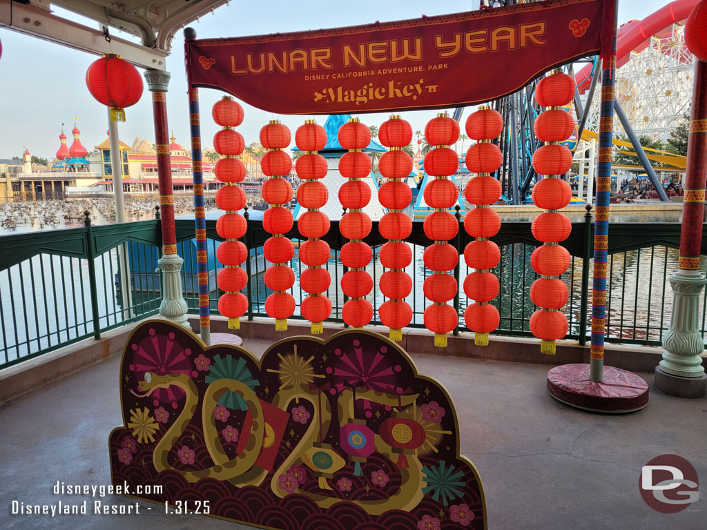 The Magic Key photo op is still available under the Silly Symphony Swings (the buttons were only available the first week though)