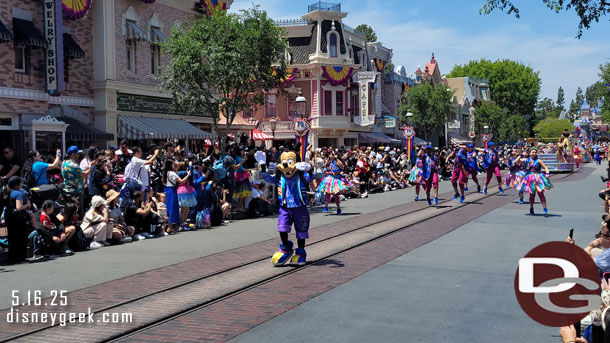 Max is marching along behind them