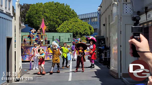 The characters waving as the parade gate closes