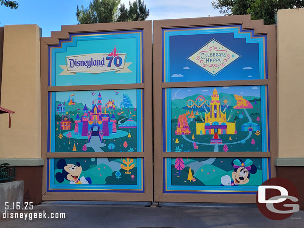 The backstage gate near World of Disney features a Disneyland 70th graphic