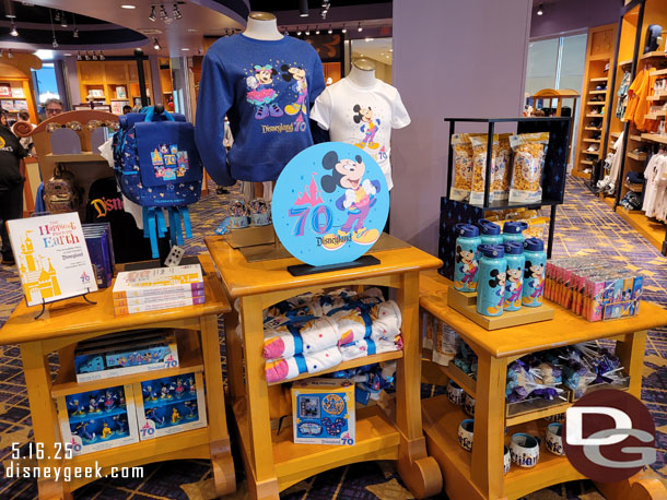 Some of the Disneyland 70th merchandise, including the new book - The Happiest Place on Earth.