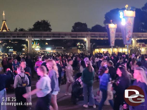 The queue to enter Disneyland extends well past the Monorail