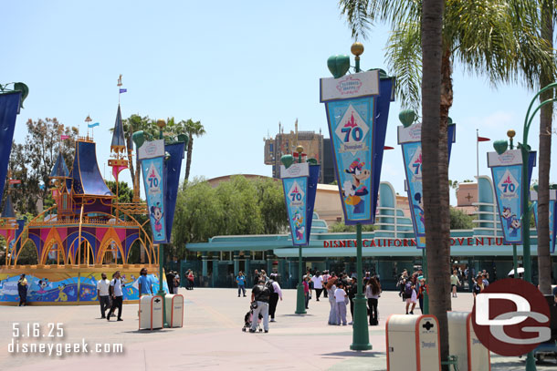 The Esplanade has a large castle music box and more 70th banners, but no time to stop right now. I want to enter the park to pick up a virtual queue spot for World of Color Happiness!