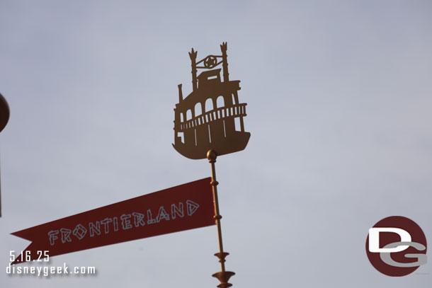 A closer look at the details of the musicbox in the esplanade. Each original land has a banner and symbol.