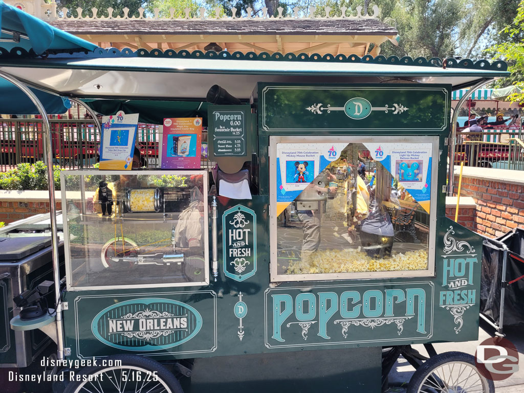 New popcorn buckets and other items are available throughout the park to celebrate the 70th.