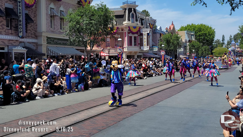 Max is marching along behind them