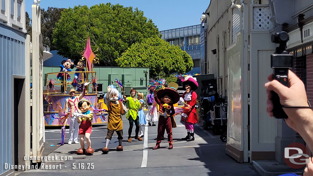 The characters waving as the parade gate closes