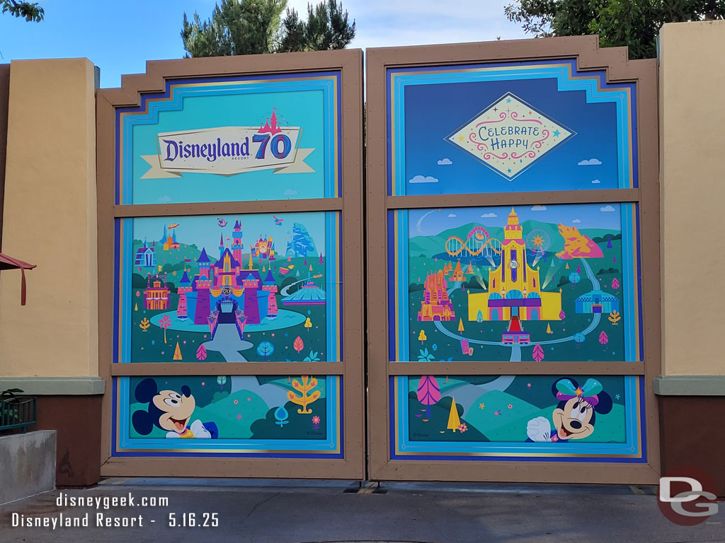 The backstage gate near World of Disney features a Disneyland 70th graphic
