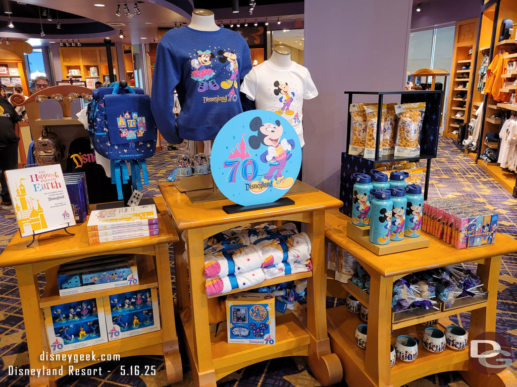 Some of the Disneyland 70th merchandise, including the new book - The Happiest Place on Earth.
