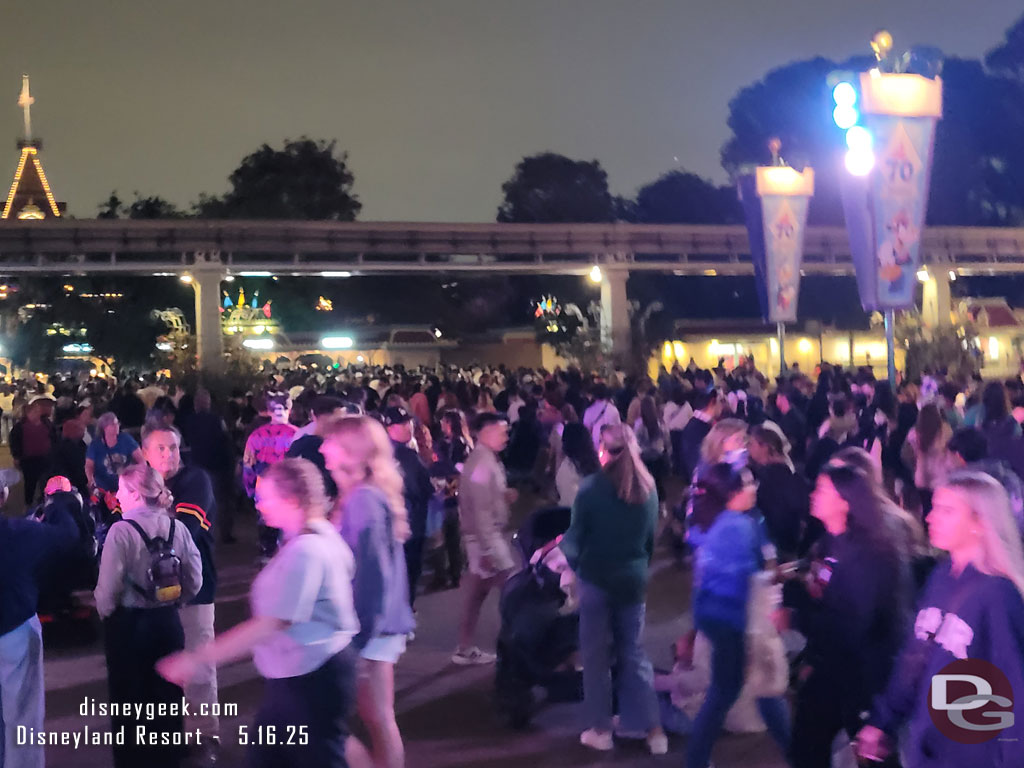 The queue to enter Disneyland extends well past the Monorail
