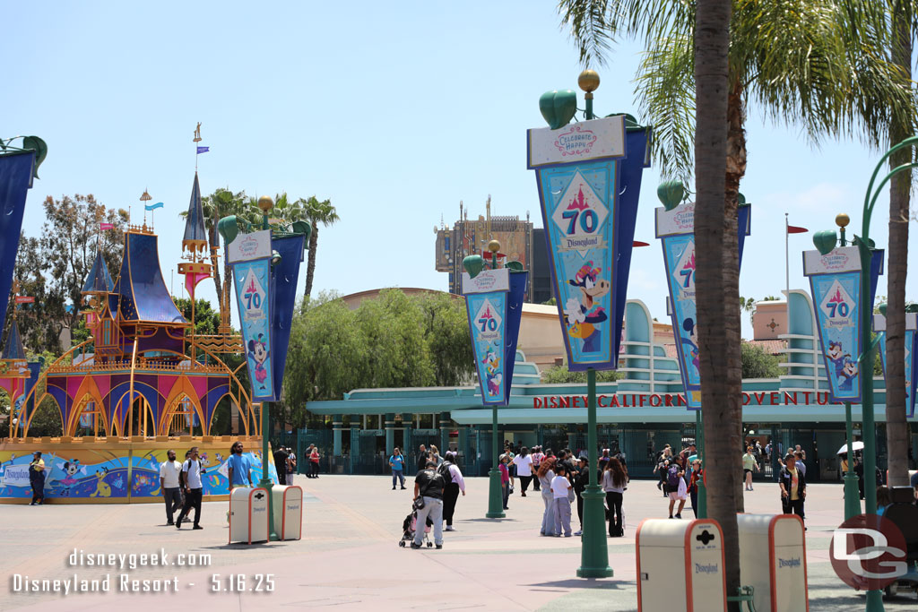 The Esplanade has a large castle music box and more 70th banners, but no time to stop right now. I want to enter the park to pick up a virtual queue spot for World of Color Happiness!