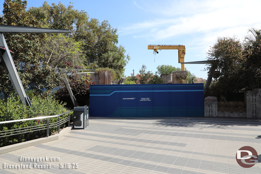 The Avengers Campus side of the walkway to Cars Land has a blue construction wall. 